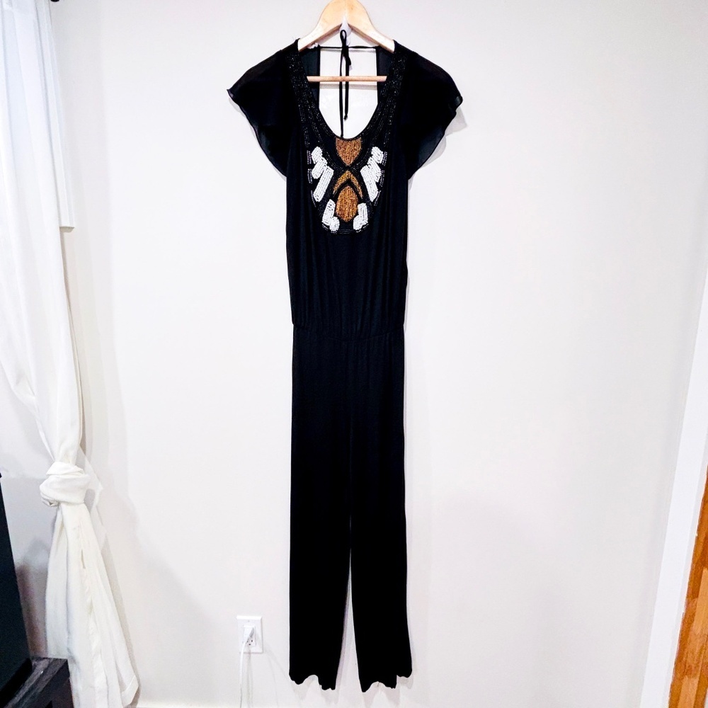 BLANCO GHIACCO Black jumpsuit with white,‎ black and gold beads to tie